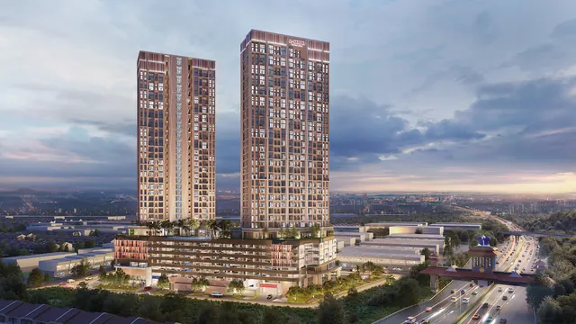 A-SOHO's two towers in warm terracotta cladding at dusk.